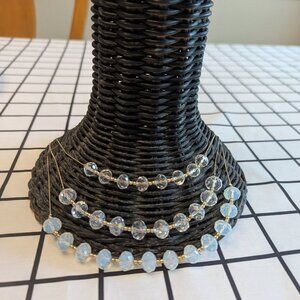 Clear beaded necklace with matching bracelets.